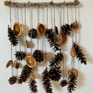 rustic pinecone wall hanging on a door