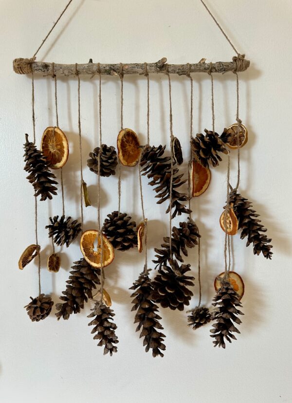 rustic pinecone wall hanging on a door