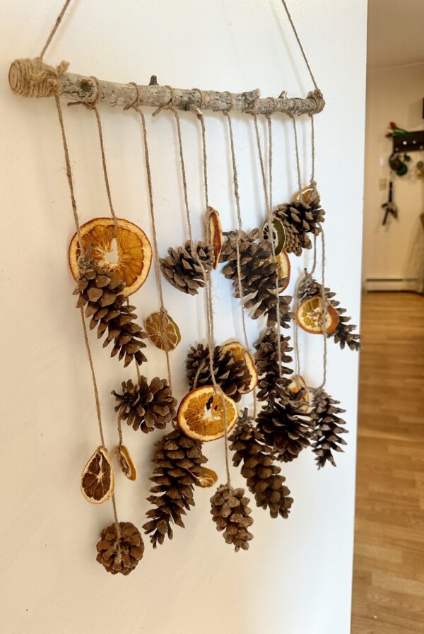 rustic pinecone wall hanging from a door